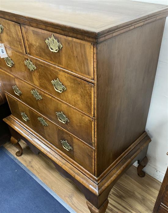 An 18th century cross banded walnut chest on stand, width 98cm, depth 56cm, height 121cm